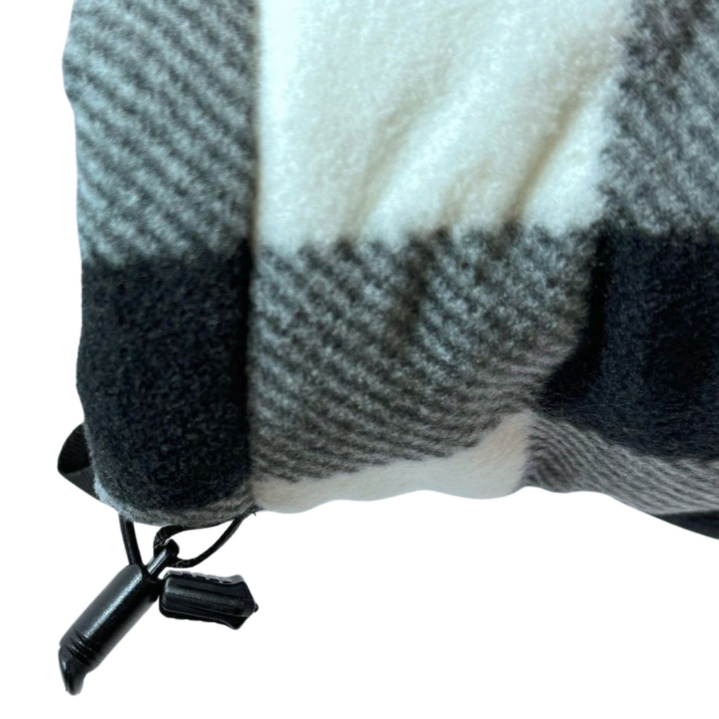 Close-up of right wrist of Black and White Buffalo Plaid Giddyup Glove™, highlighting adjustable cuff and plaid pattern details.