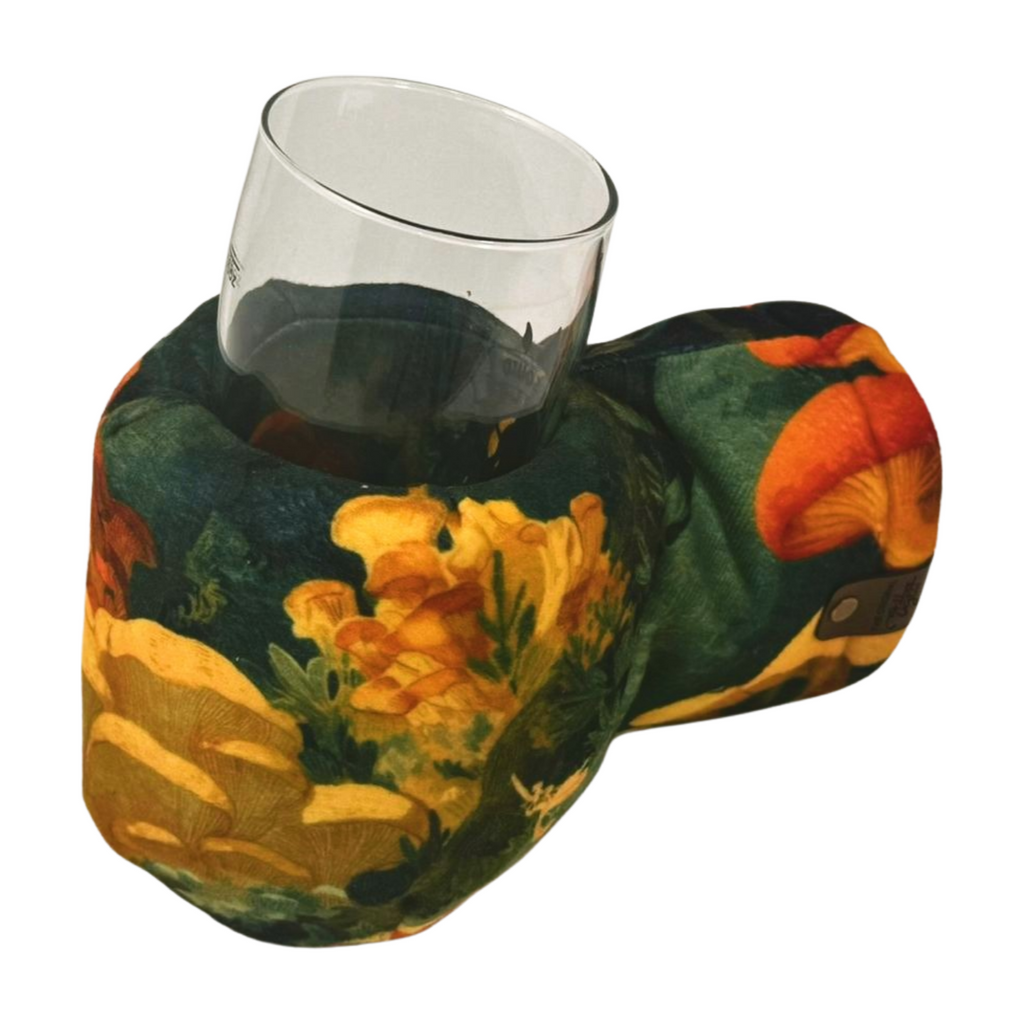 Chanterelle Chorus Giddyup Glove™ gripping hot or cold beverage, showing insulated drink-holding mitten in action