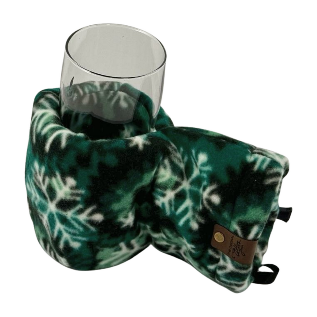 Top view of Forest Flake Giddyup Glove™ holding a glass for après-ski or sidelines