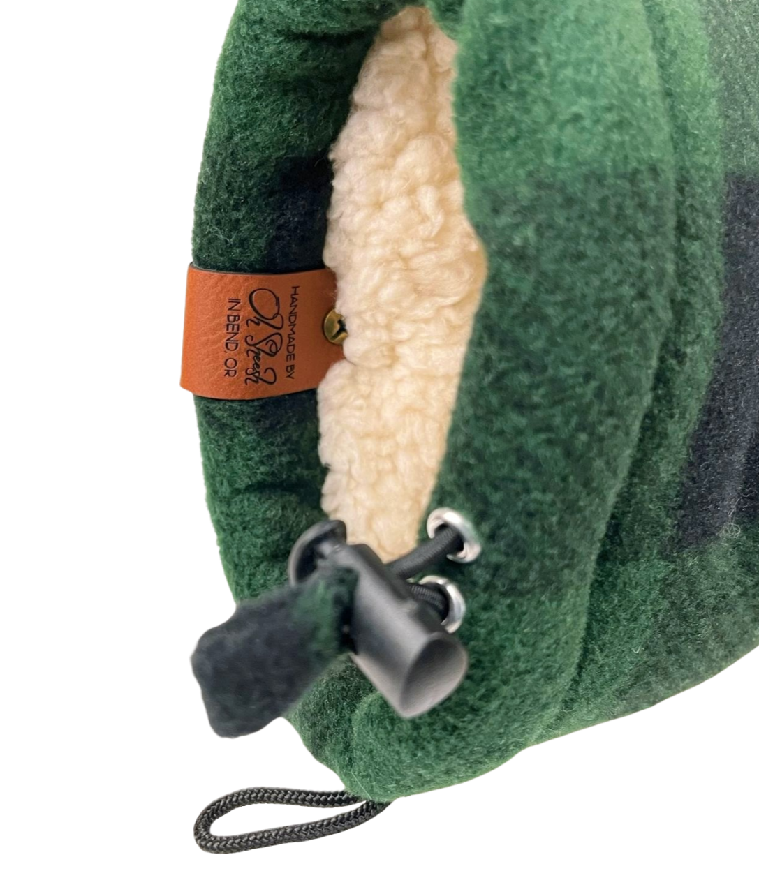 Close-up of green and black buffalo plaid Giddyup Glove™ in light fleece, right wrist detail, winter glove.