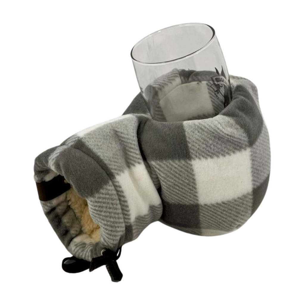 Top view of Grey and White Buffalo Plaid Giddyup Glove™ holding a glass for après-ski or sidelines