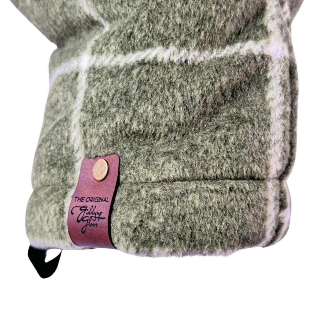 Close-up of olive green heavyweight plaid Giddyup Glove™ wrist strap and insulated cuff for sidelines or outdoor use