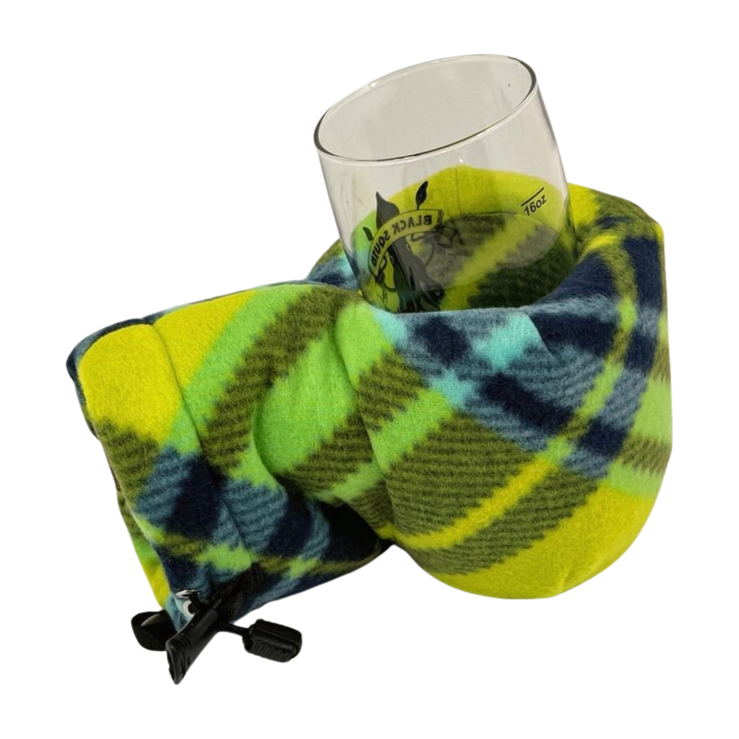 Limey Plaid Giddyup Glove™ securing a glass, perfect for cozy outdoor or indoor use.
