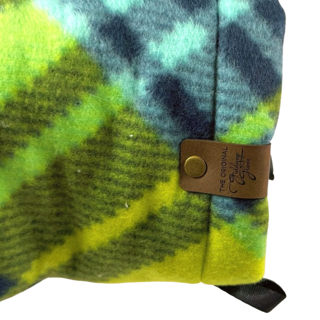 Detailed close-up of the Limey Plaid Giddyup Glove™ on the left wrist, focusing on stitching and plaid texture.