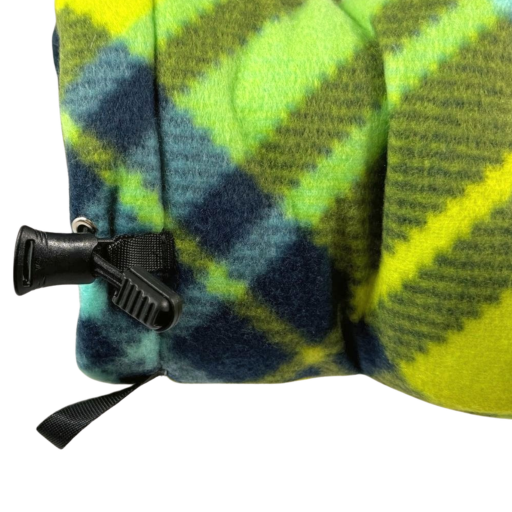 Close-up of the Limey Plaid Giddyup Glove™ on the right wrist, showing adjustable fit and plaid detail.