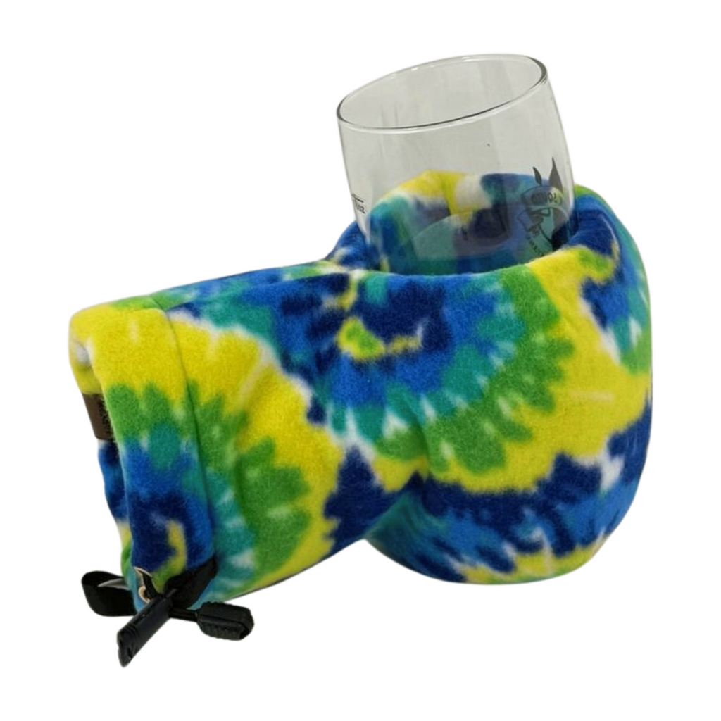 Top view of Tie-Dye Giddyup Glove™ holding a glass for après-ski or sidelines