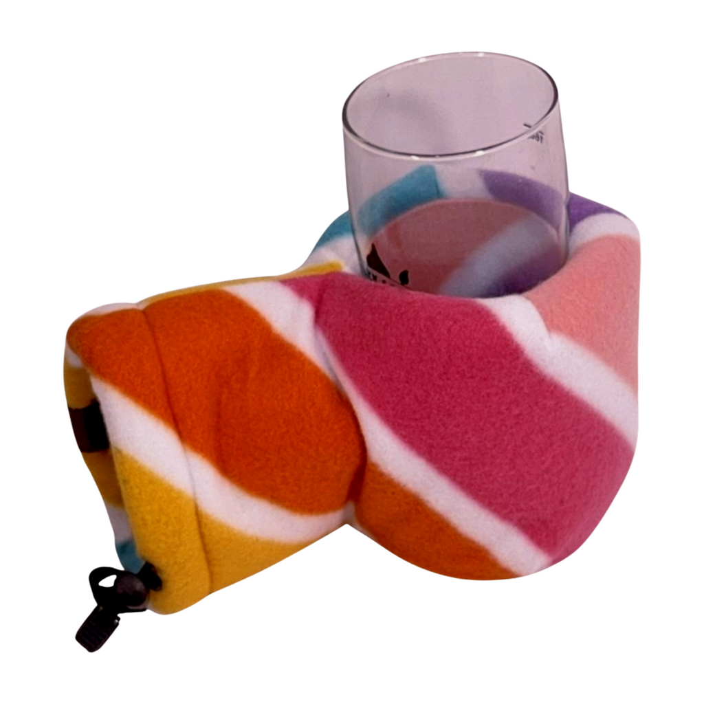 Unicorns Candy Cane Giddyup Glove™ holding a glass, insulated fleece mitten designed for cozy winter drinks and festive fun.